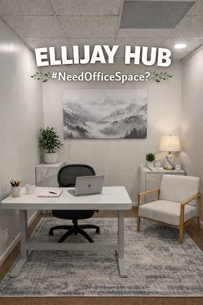 An Ellijay Hub office suite with a desk, gray and white decor and a mountain painting